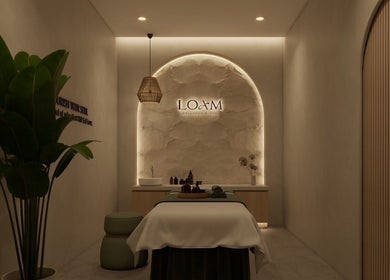 Relaxing spa room at LOAM Wellness & Spa, Las Vegas, Nevada, US with massage table and calming decor.
