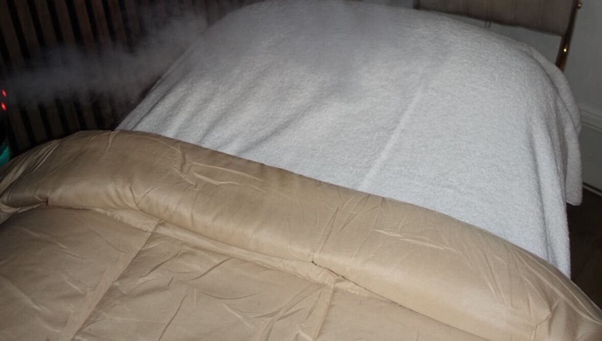 Cozy massage table at HOUSE OF GOLD, Monifieth, Scotland, GB ready for a luxury wellness experience.