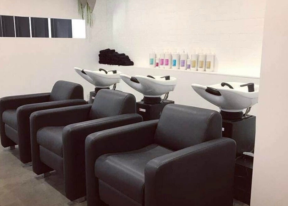 Modern salon stations at Blondes & Blowouts Tuggerah, Tuggerah, New South Wales, AU. Comfortable wash areas ready for use.