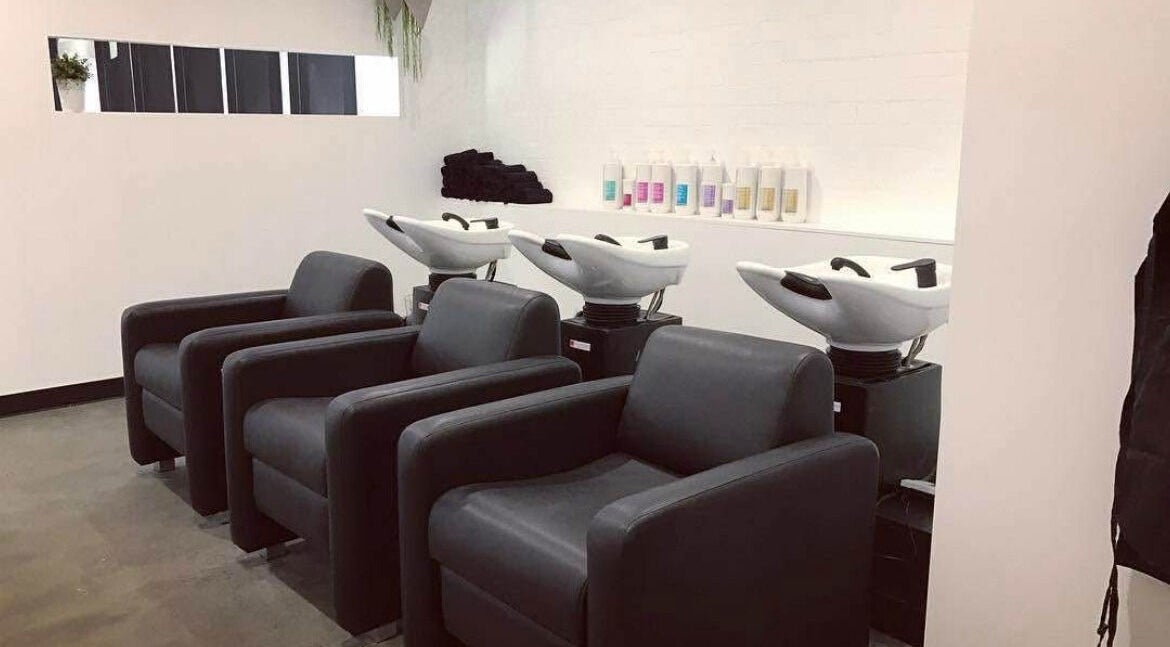 Modern salon stations at Blondes & Blowouts Tuggerah, Tuggerah, New South Wales, AU. Comfortable wash areas ready for use.