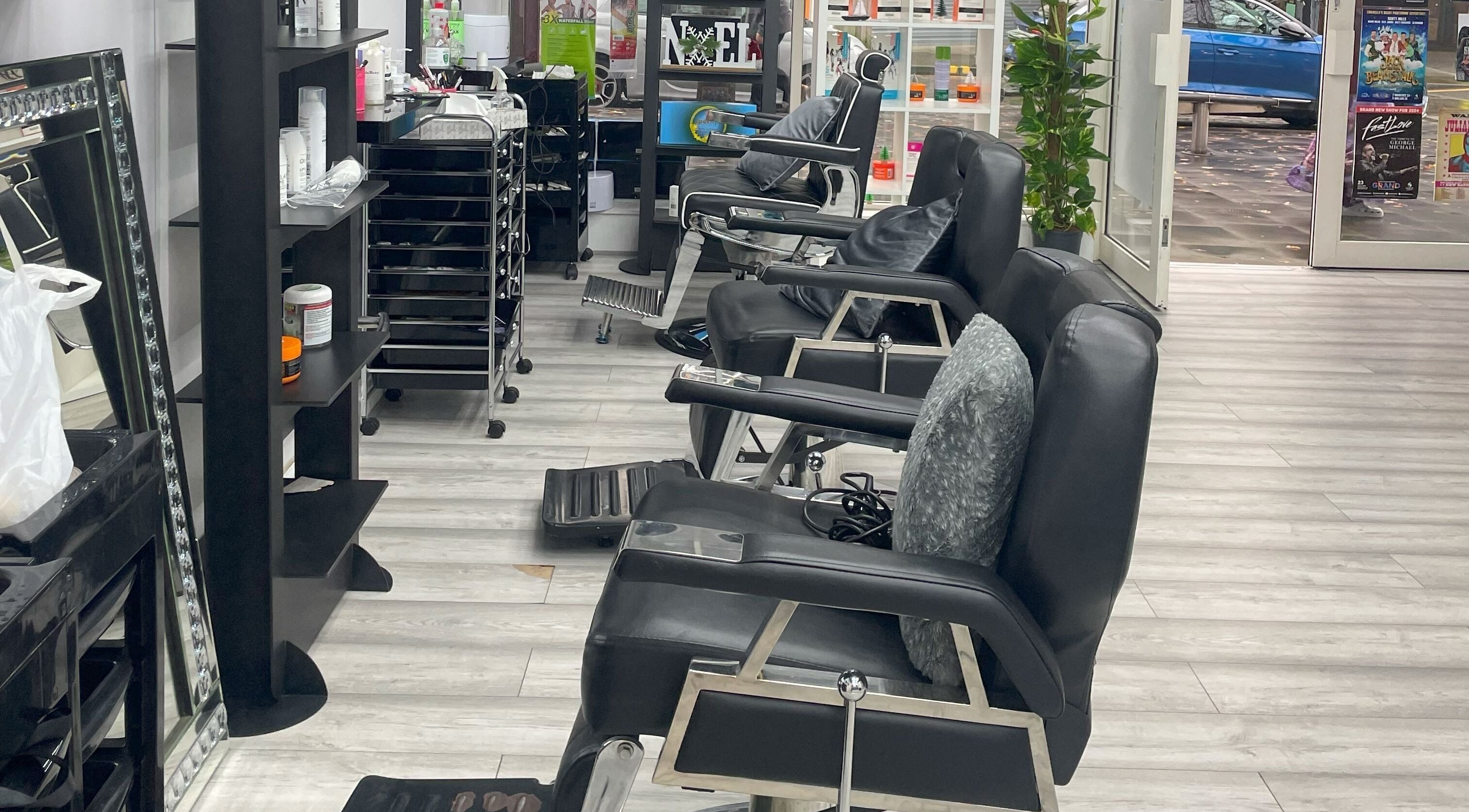 Modern salon chairs and styling stations at Naz Beauty Studio in Swansea, Wales, GB.