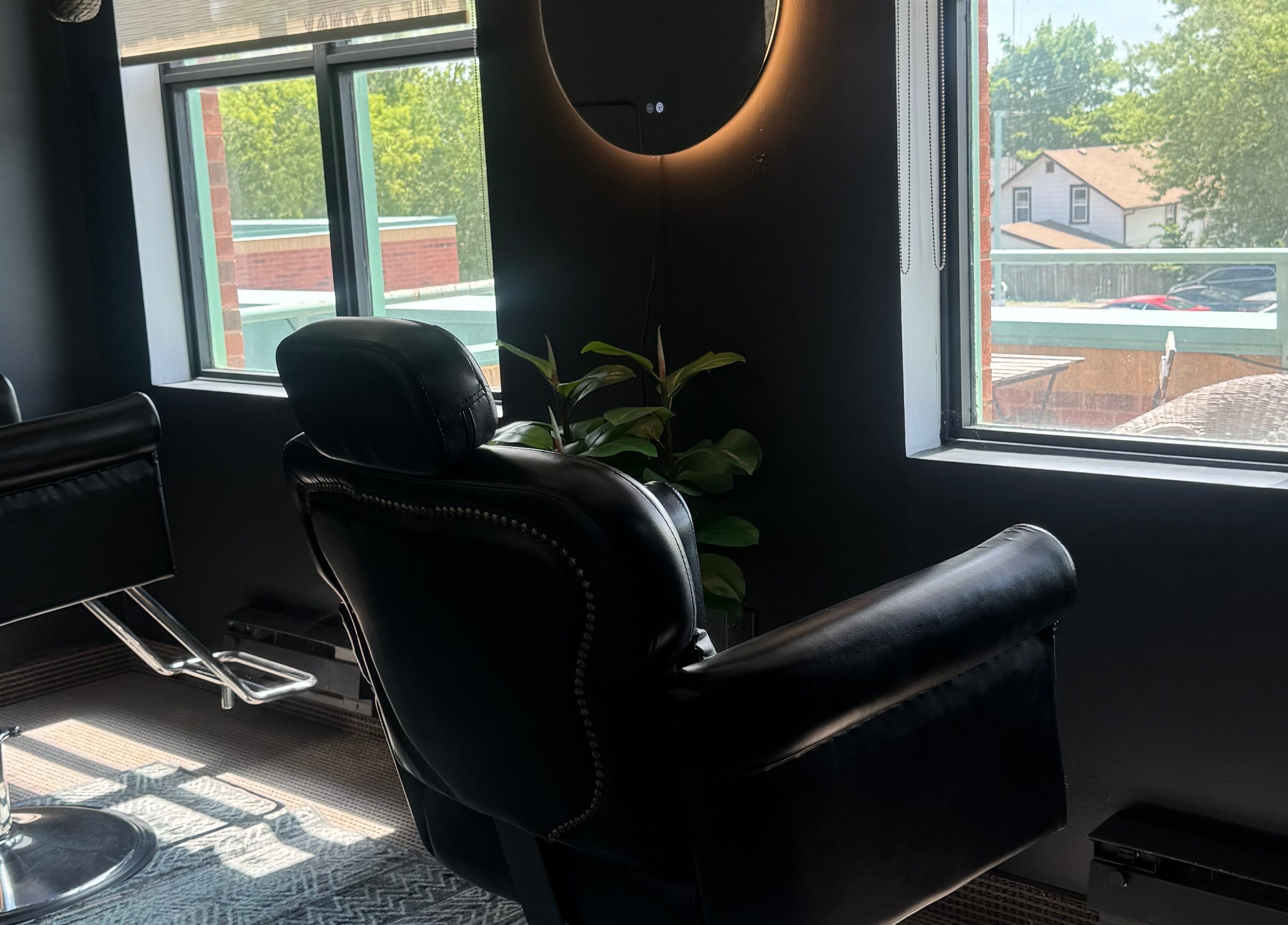 Luxury chairs at The Brandy Alexander, a chic salon in Whitby, Ontario, CA with ample natural light.