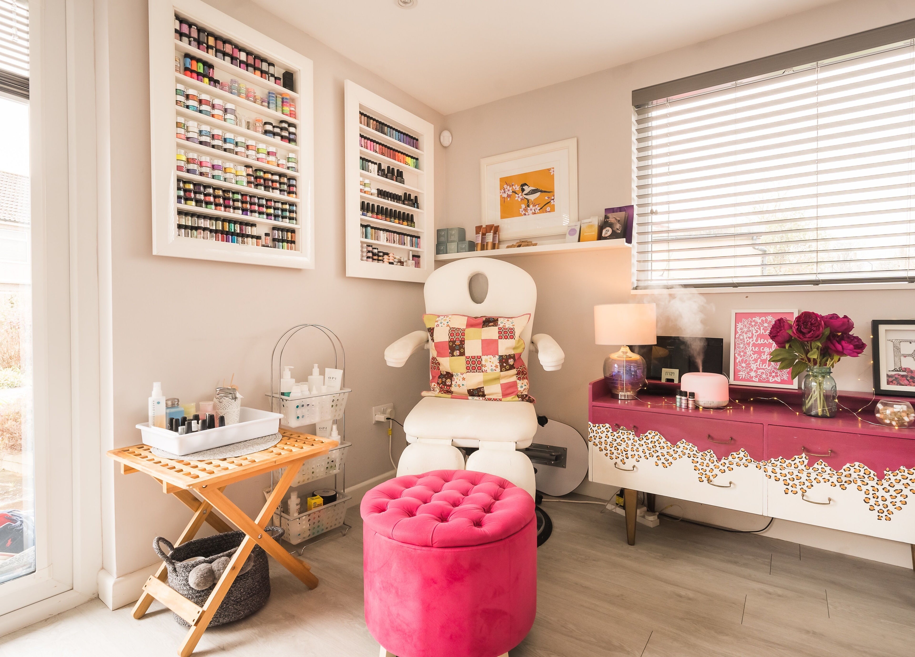 Fuchsia Beauty Bristol, England, GB nail salon corner with plush pink seating and organized polish display.