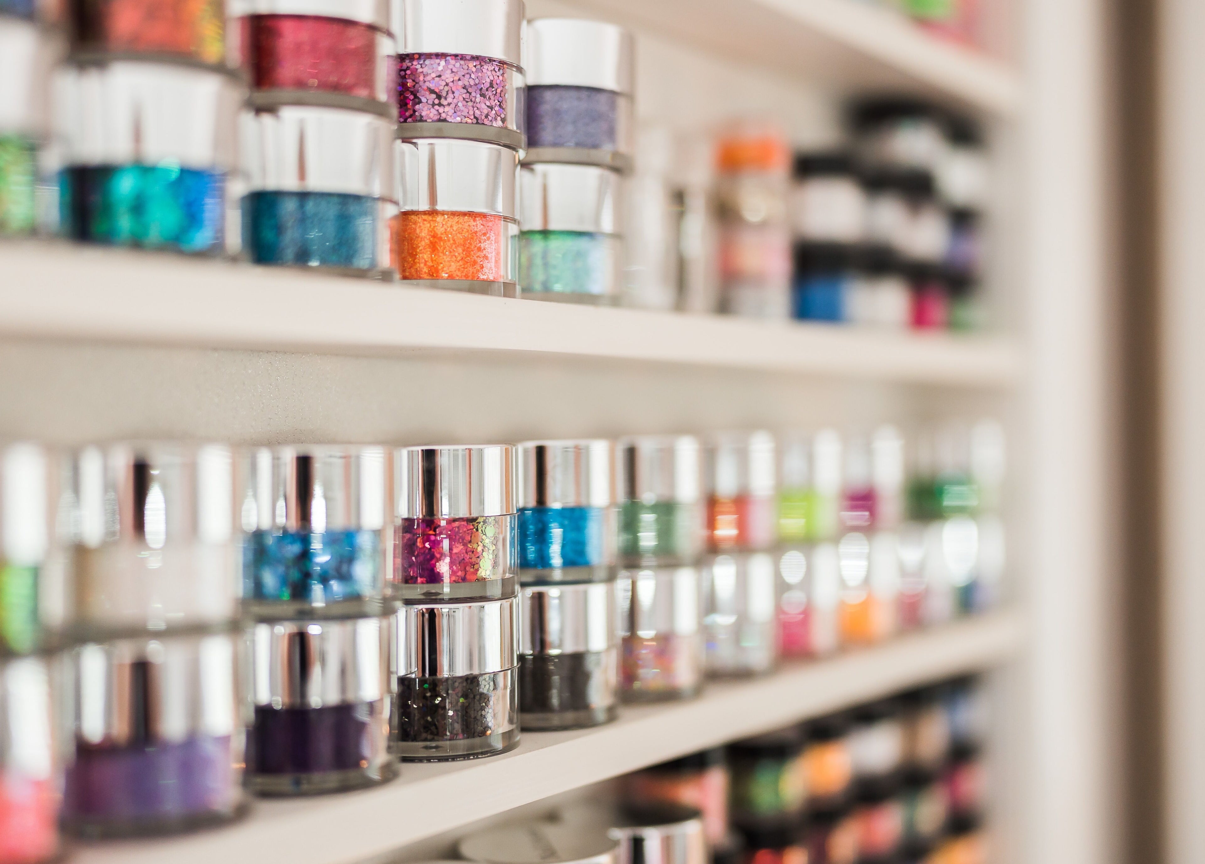 Colorful nail polish jars on display at Fuchsia Beauty, Bristol, England, GB. Brighten your nails today.