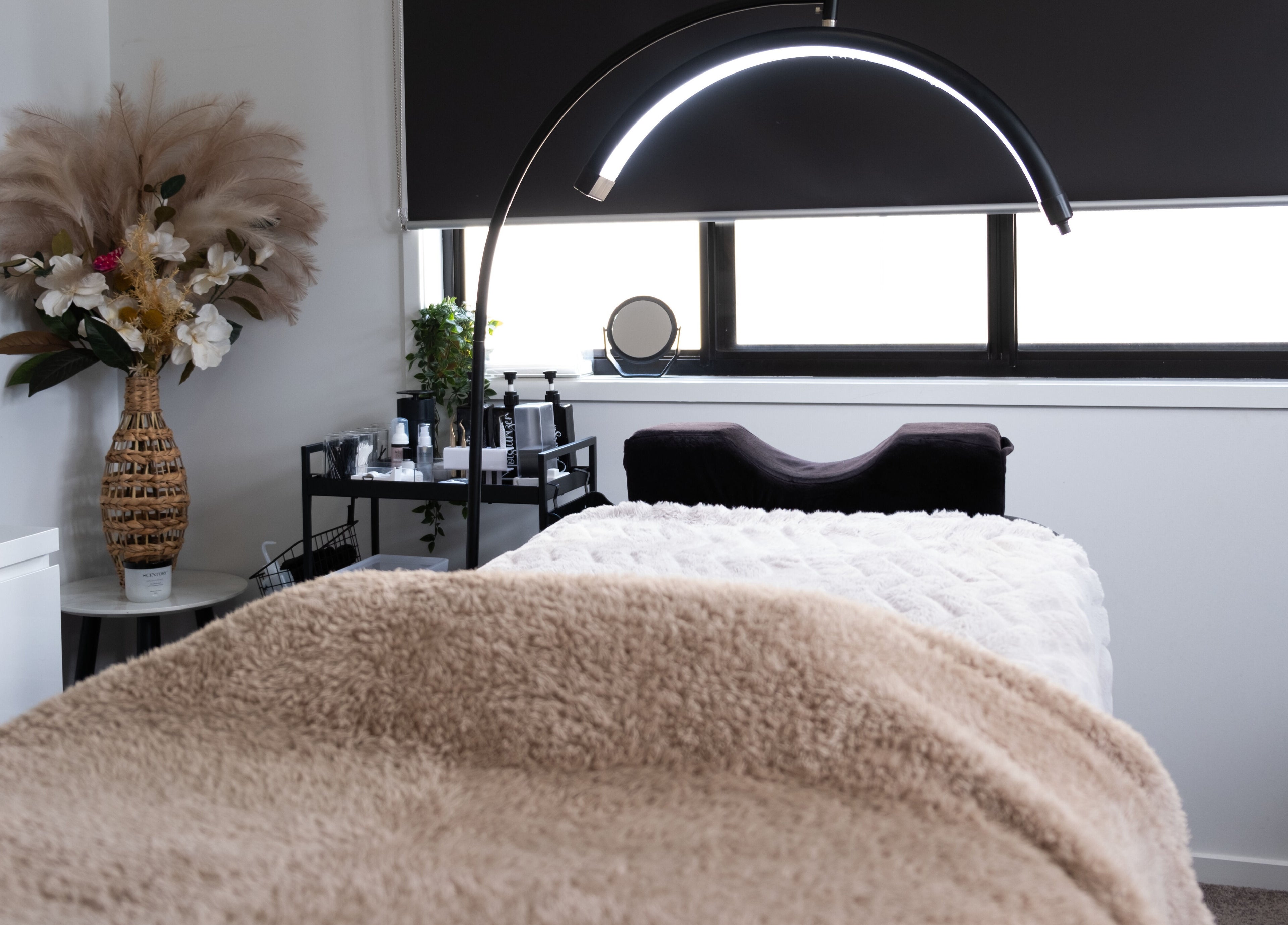 Relaxing treatment room at Flutter Your Lashes in Redland Bay, Queensland, AU, showcasing a cozy aesthetic.