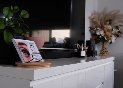 Chic interior of Flutter Your Lashes, Redland Bay, Queensland, AU with stylish decor and lush plants.