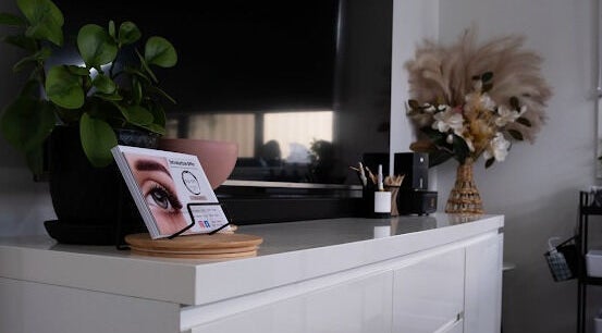 Chic interior of Flutter Your Lashes, Redland Bay, Queensland, AU with stylish decor and lush plants.