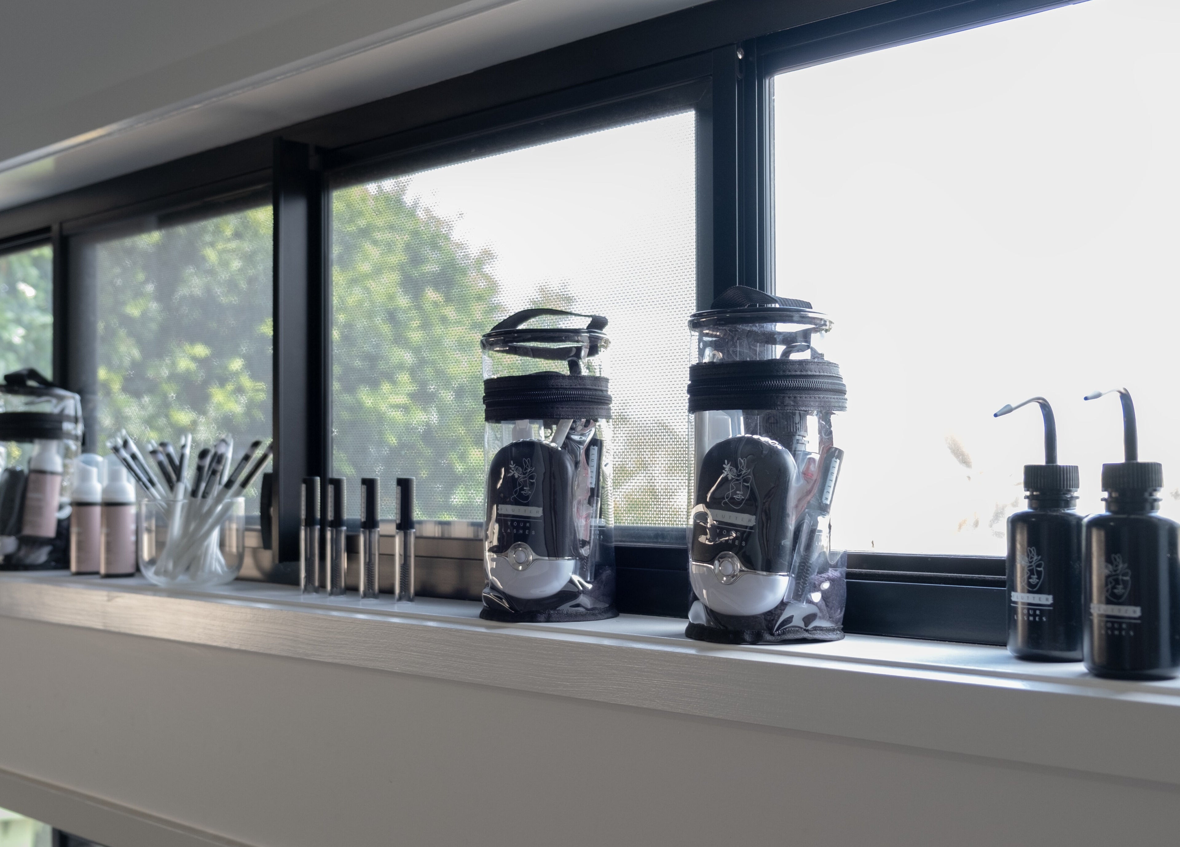 Lash tools and products at Flutter Your Lashes, Redland Bay, Queensland, AU, by the sunny window.