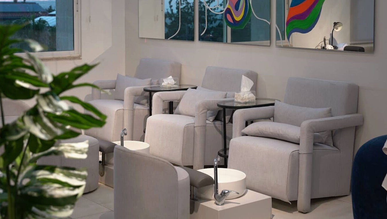 Cozy pedicure chairs at Gloss'd Beauty Bar, Amman, Amman Governorate, JO, invite relaxation.