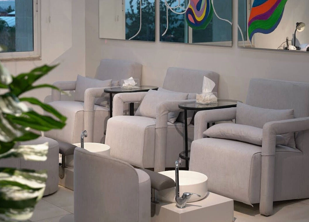 Cozy pedicure chairs at Gloss'd Beauty Bar, Amman, Amman Governorate, JO, invite relaxation.