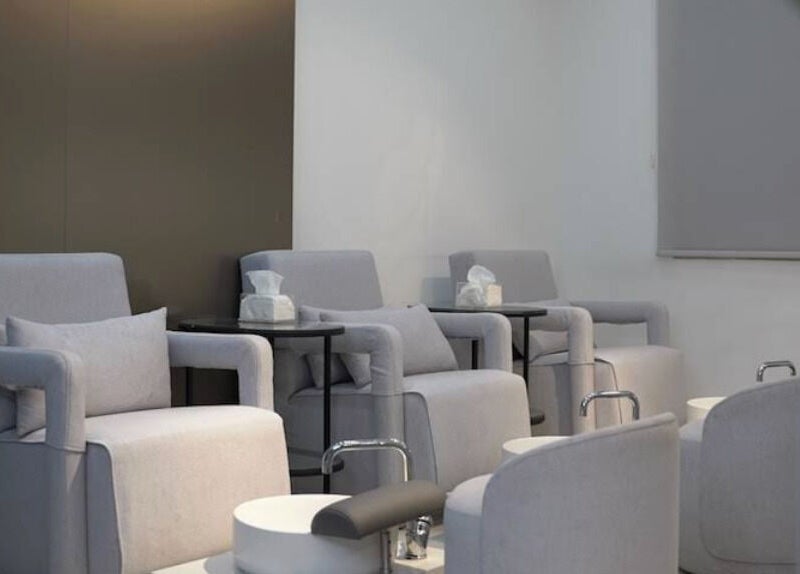 Elegant pedicure chairs at Gloss'd Beauty Bar, Amman, Amman Governorate, JO, providing a serene ambiance.