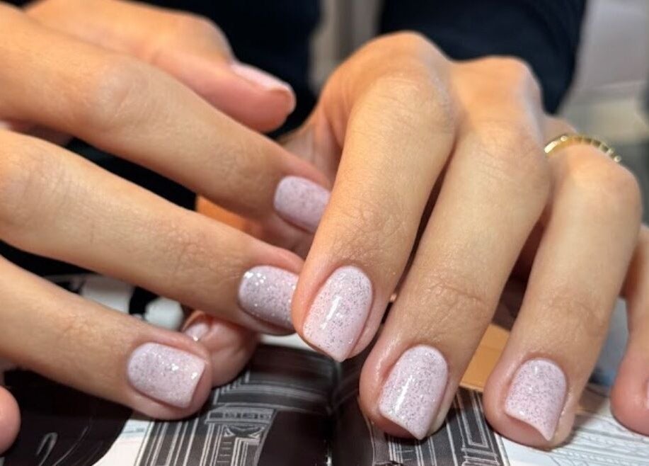 Elegant sparkly manicure at Gloss'd Beauty Bar, Amman, Amman Governorate, JO for a polished look.