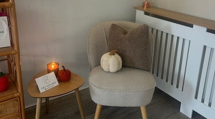 Cozy seating area with knit decor at Lash Love Faye, Birkenhead, England, GB.
