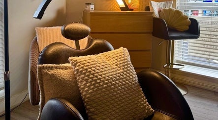 Relaxing chair with cushions at Lash Love Faye, Birkenhead, England, GB. Perfect for comfort and wellness.