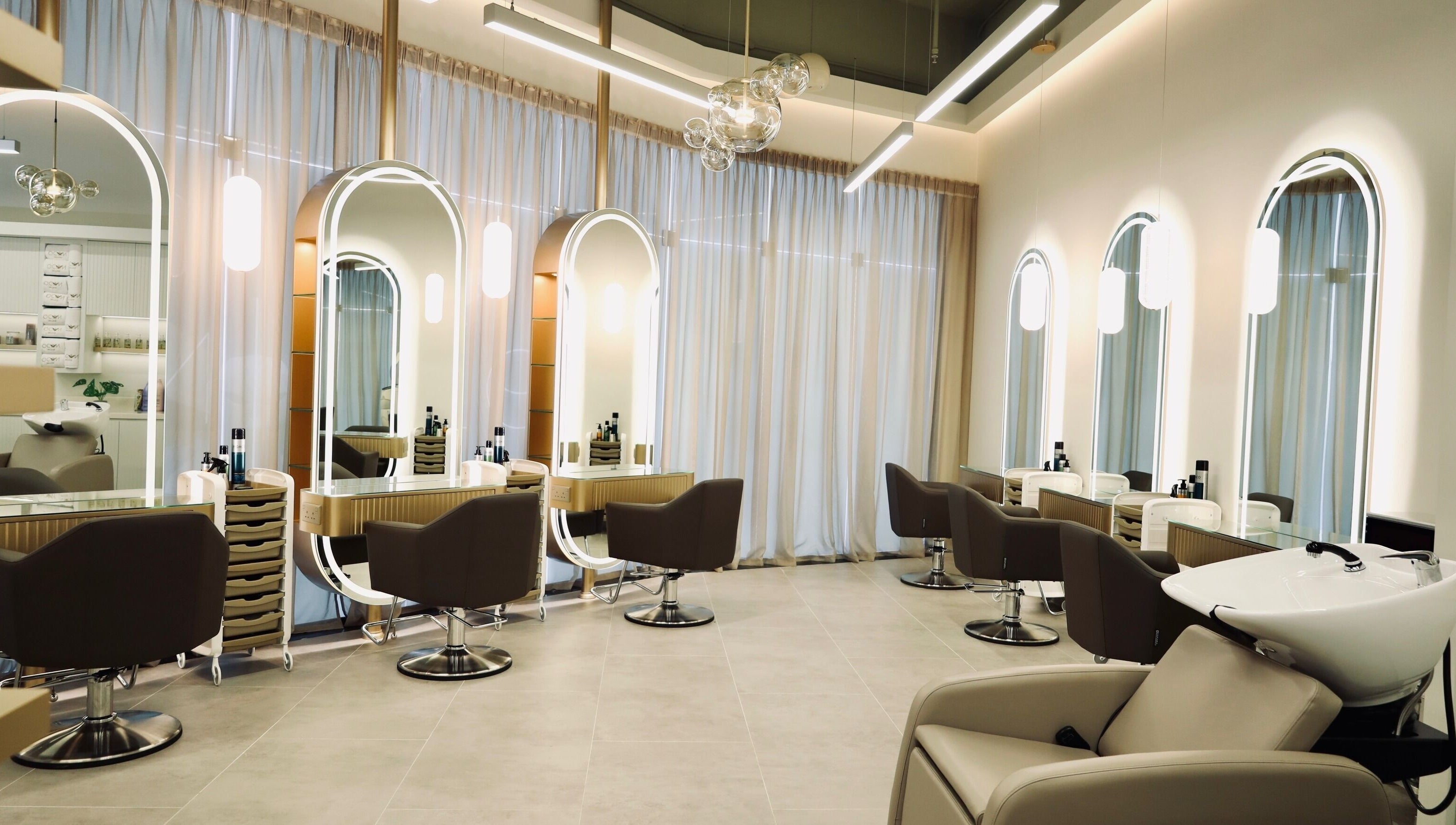Stylish interior at Nado Salon in Sharjah, Sharjah, AE showcasing chic chairs and modern design.
