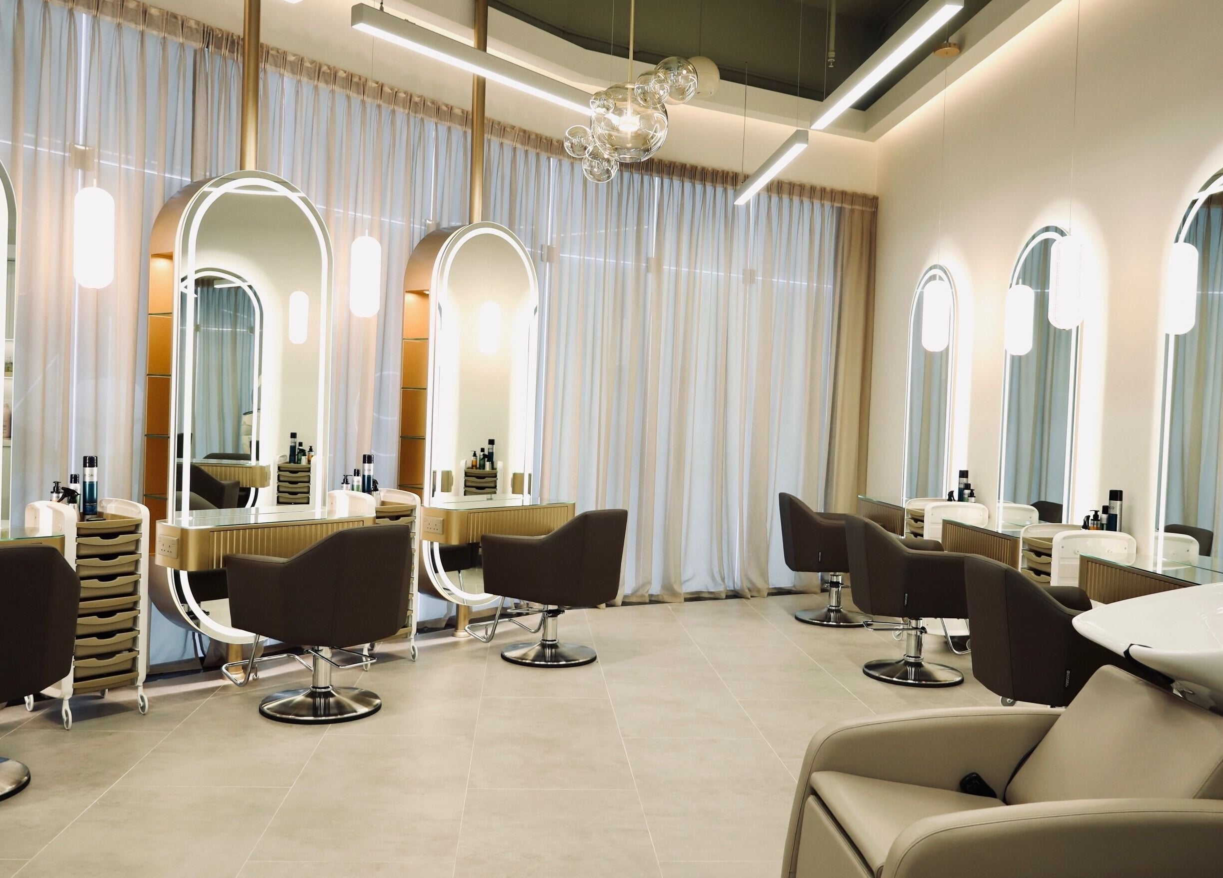 Stylish interior at Nado Salon in Sharjah, Sharjah, AE showcasing chic chairs and modern design.