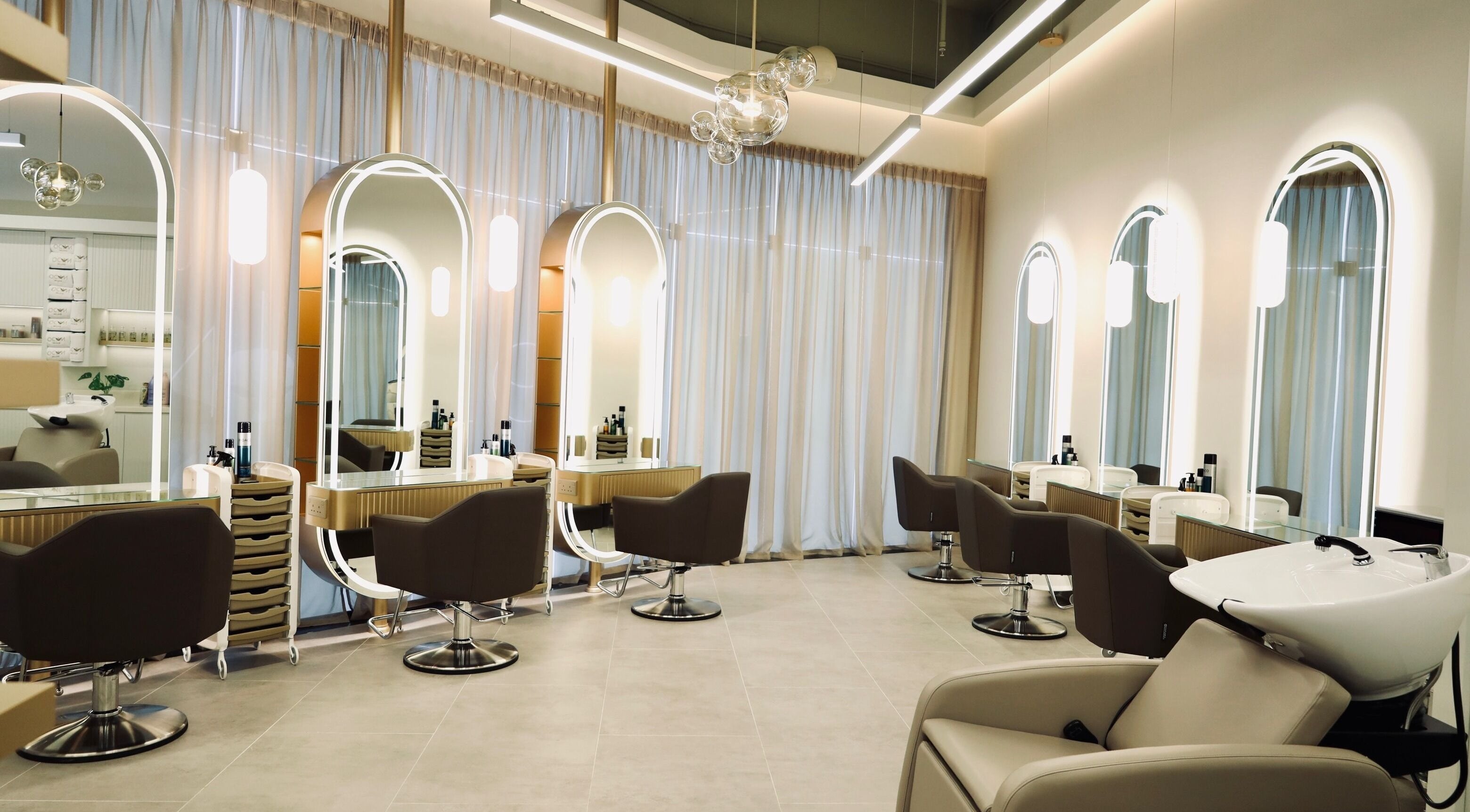 Stylish interior at Nado Salon in Sharjah, Sharjah, AE showcasing chic chairs and modern design.