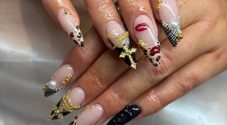 Intricate nail art at Glam’d by Grace in Kilkenny, County Kilkenny, IE, featuring gold and leopard patterns.