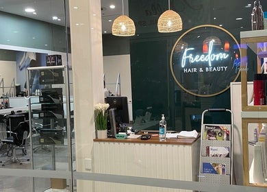 Entrance of Freedom Hair and Beauty Pukekohe, showcasing modern salon interior in Pukekohe, Auckland, NZ.