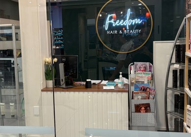 Reception area of Freedom Hair and Beauty Pukekohe, Pukekohe, Auckland, NZ with products and decor.