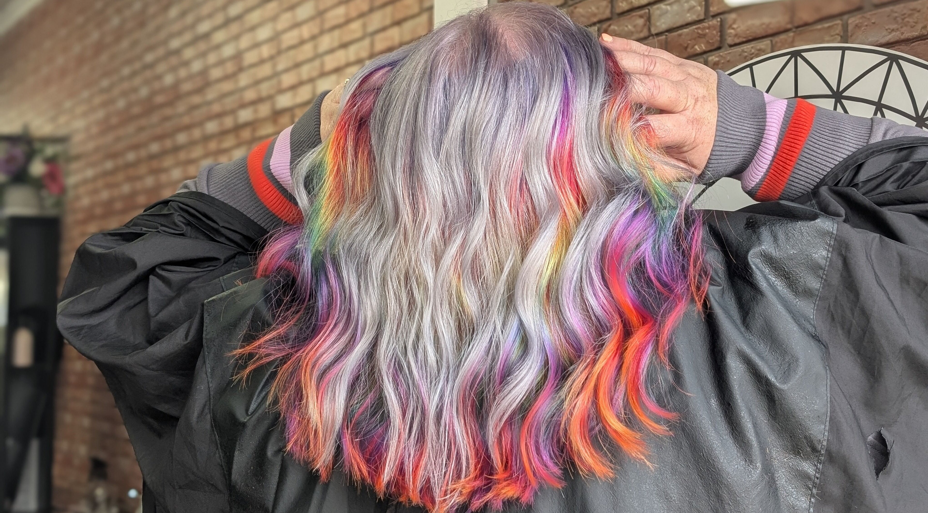 Rainbow hair coloring at Wilde Style Hair in Pooraka, South Australia, AU showcasing vivid, multicolor tones.