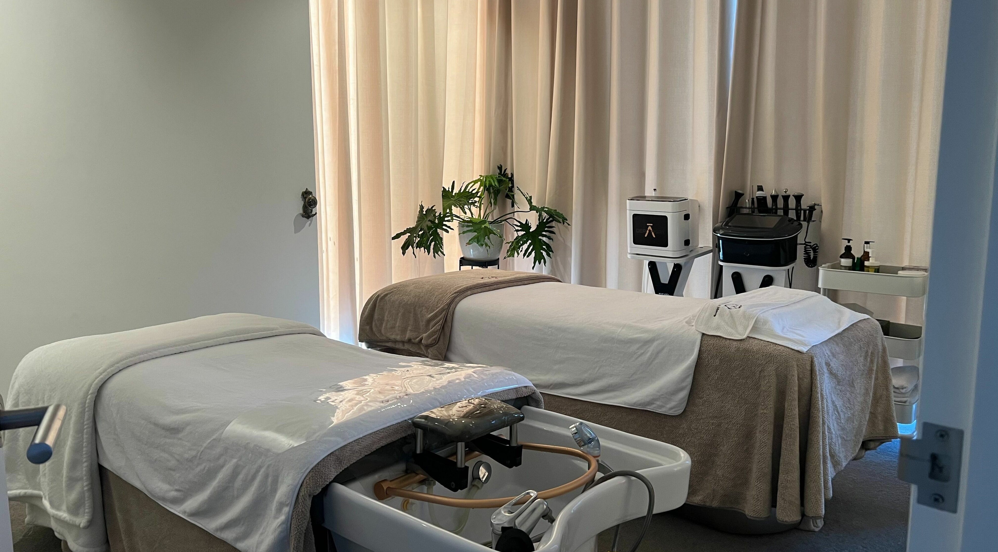 Calming massage room at Young Beauty Massage, Claremont, Western Australia, AU with two beds and soft lighting.