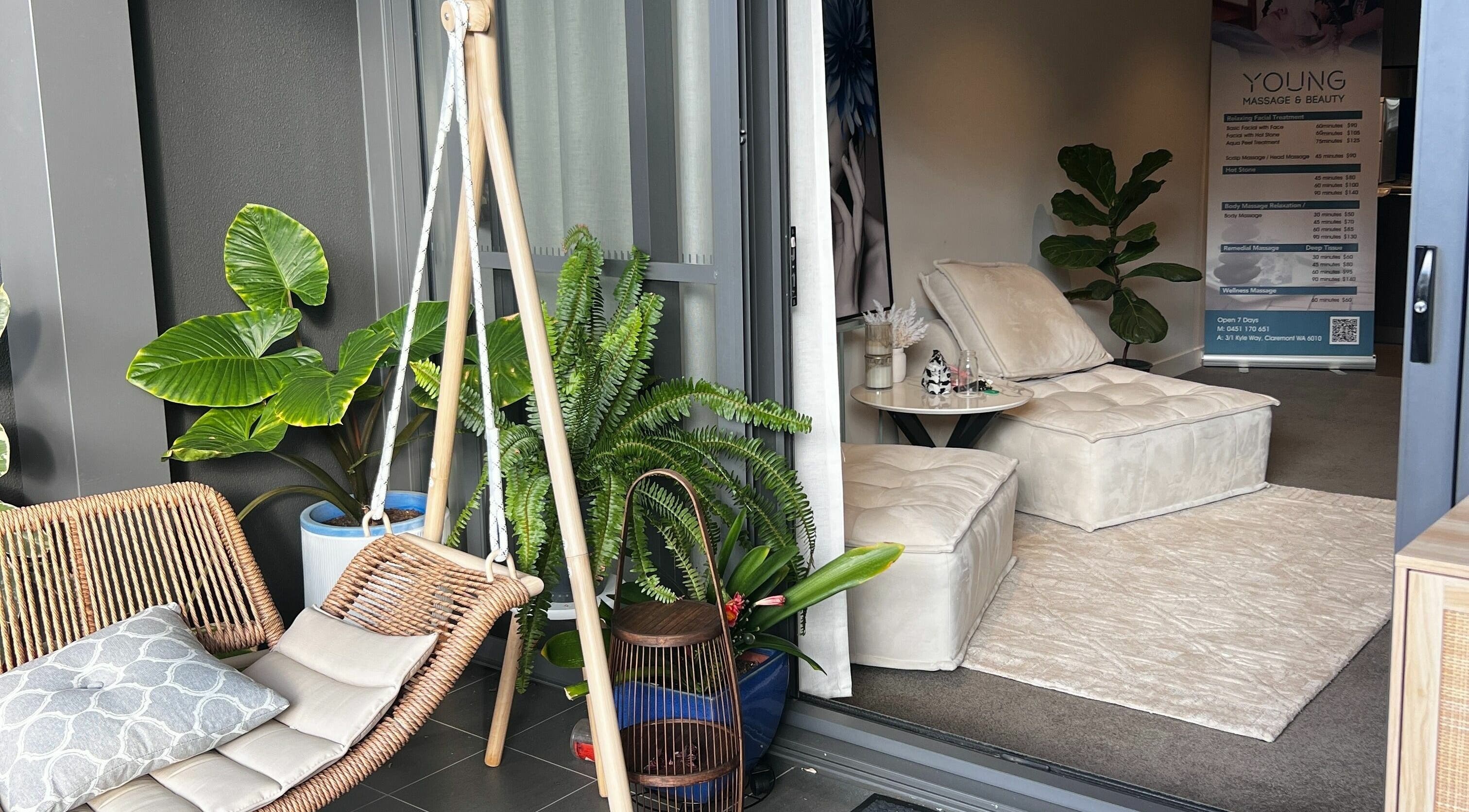 Relaxing seating area at Young Beauty Massage in Claremont, Western Australia, AU, showcasing lush greenery.