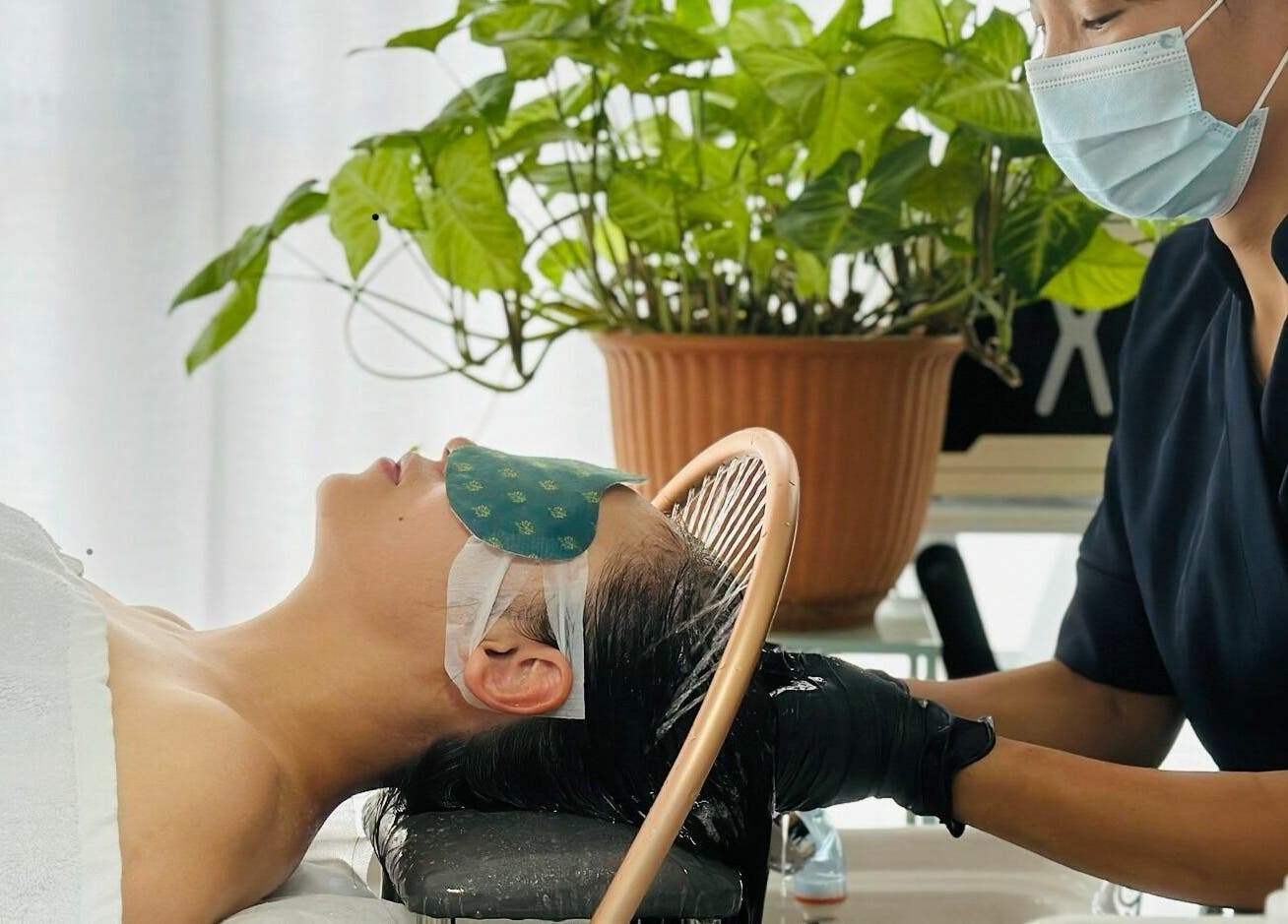 Spa therapist performs a relaxing hair treatment at Young Beauty Massage, Claremont, Western Australia, AU.