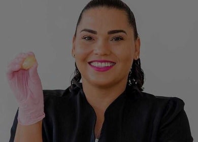 Smiling beautician with sugaring paste at Bonaire Beauty By X in Kralendijk, Bonaire, BQ.