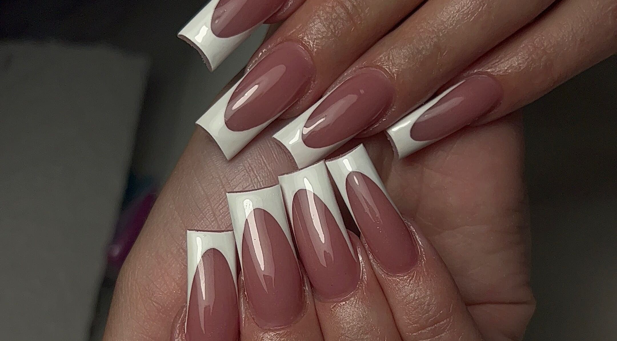 Manicured nails with French tips at DCE Care, Willemstad, Curaçao, CW.