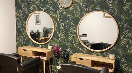 Elegant beauty stations at Melissa Ann HAIR STUDIO, Wandi, Western Australia, AU with round mirrors and lush decor.