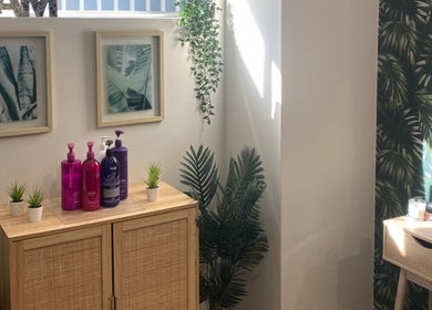 Stylish corner at Melissa Ann HAIR STUDIO, Wandi, WA with products, greenery, and decor.