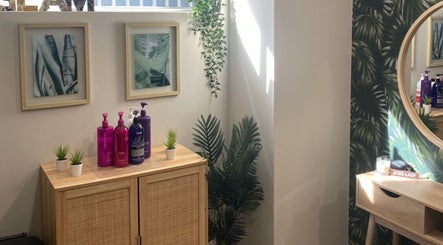 Stylish corner at Melissa Ann HAIR STUDIO, Wandi, WA with products, greenery, and decor.