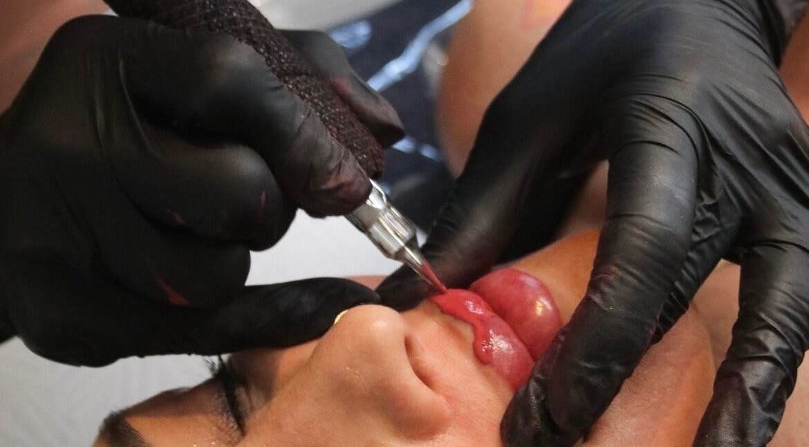 Lip tattooing session at Angelic Aesthetics, Cape Town, Western Cape, ZA, showcasing precise technique.