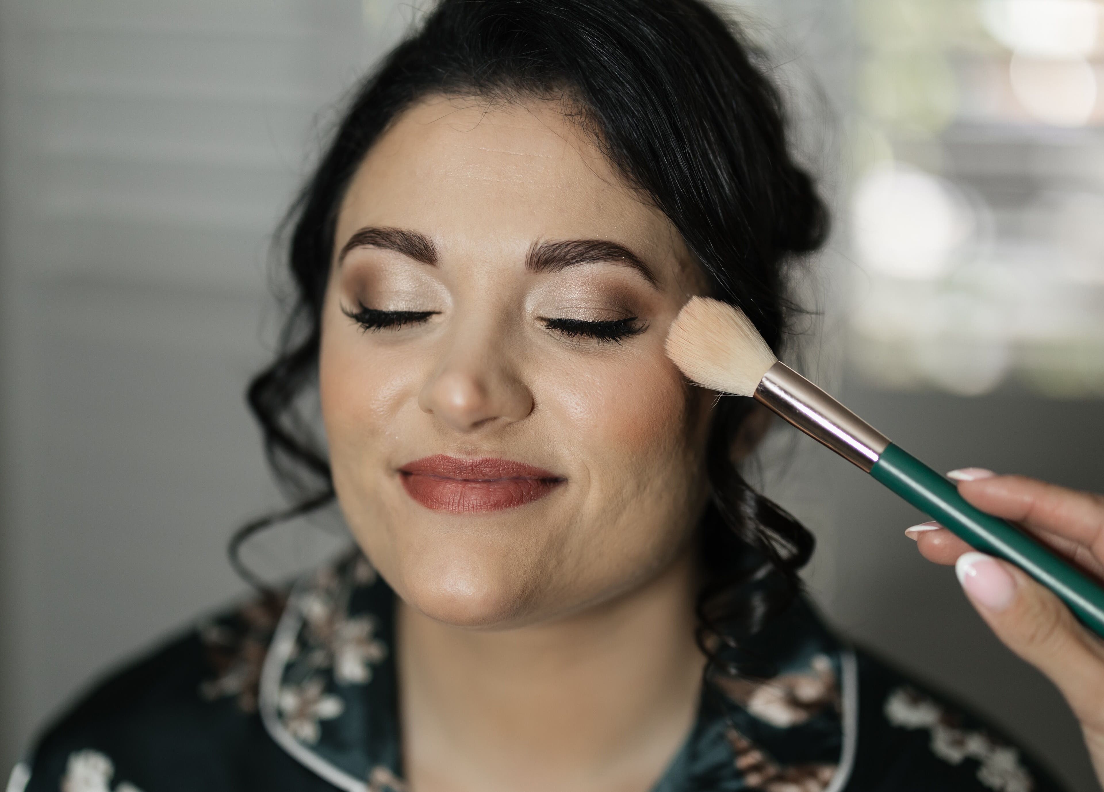 Client enjoying professional makeup at Angelic Aesthetics, Cape Town, Western Cape, ZA.