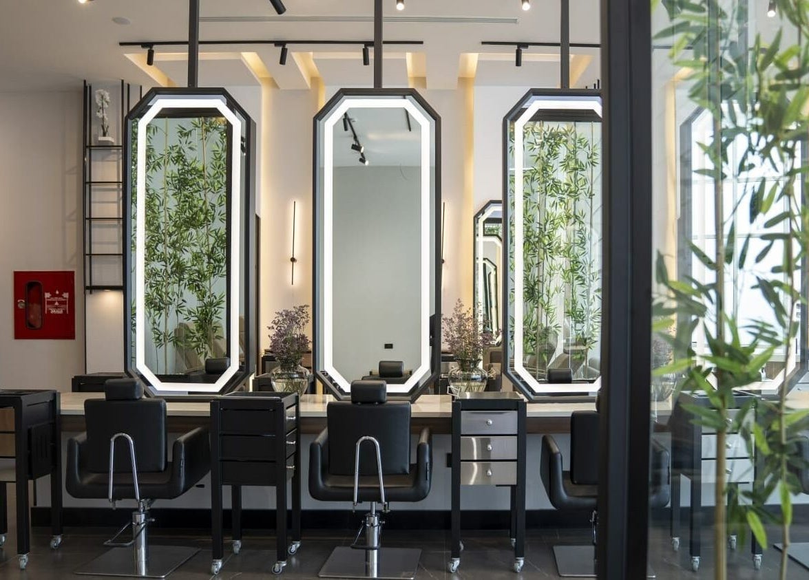 Modern salon chairs and mirrors at Fayzacenter, Riyadh, Riyadh Province, SA, offering a sleek beauty experience.