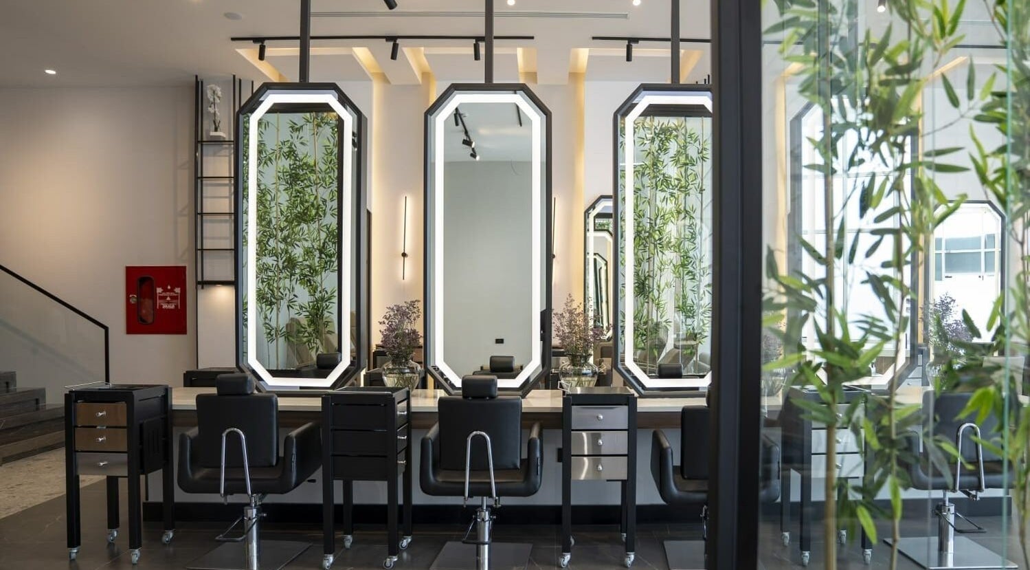 Modern salon chairs and mirrors at Fayzacenter, Riyadh, Riyadh Province, SA, offering a sleek beauty experience.
