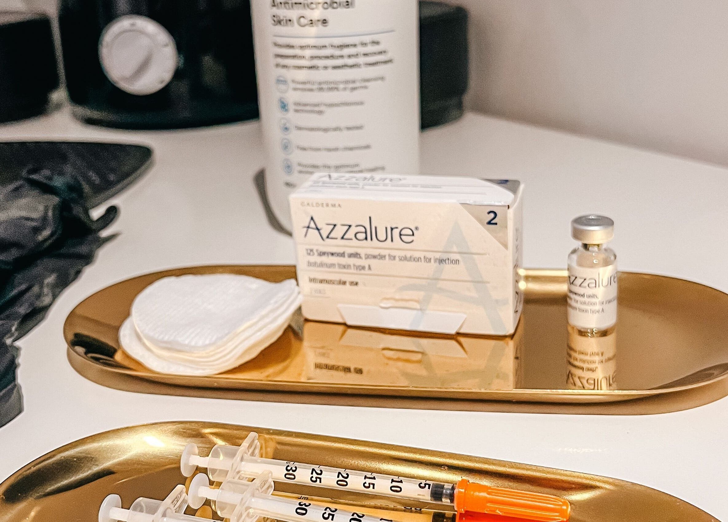 Aesthetic treatment tools at The Cheshire Clinic - Culcheth Clinic, Warrington, England, GB on golden trays.