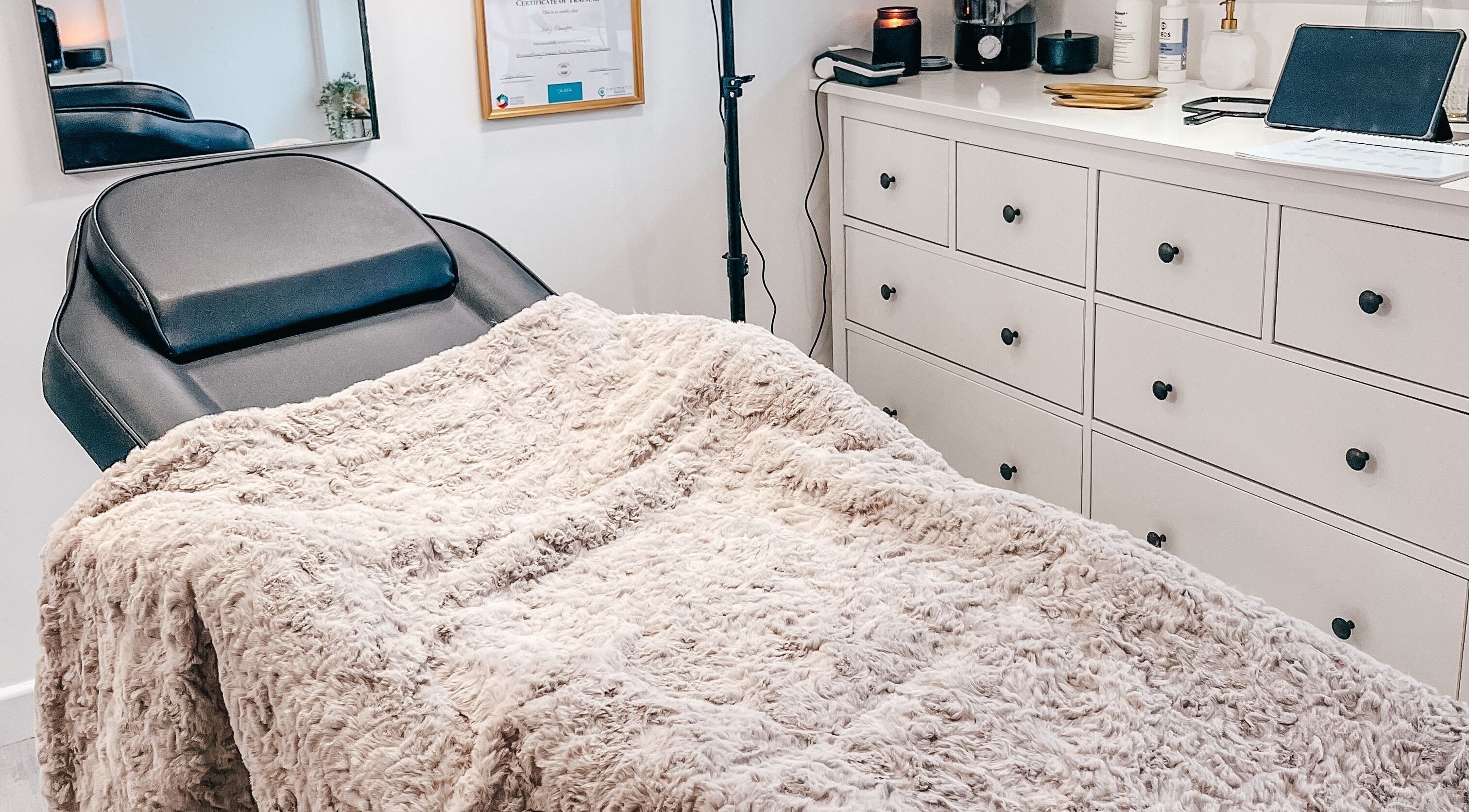 Chic treatment room at The Cheshire Clinic - Culcheth, Warrington, England, GB, featuring a plush blanket.