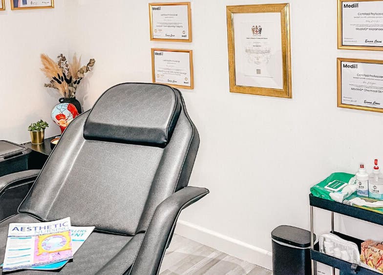 Elegant interior of The Cheshire Clinic - Newton le Willows with a treatment chair and certificates in Newton-le-Willows, England, GB.