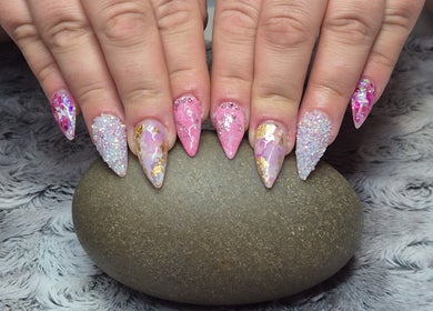 Stunning glittery nail art from Unique Nail Co in Kadina, South Australia, AU, showcasing vibrant designs.