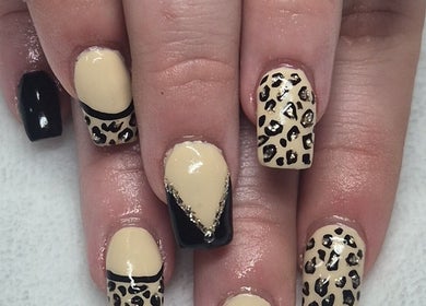 Stylish leopard print nail art at Unique Nail Co, Kadina, South Australia, AU. Perfect blend of elegance and trend.