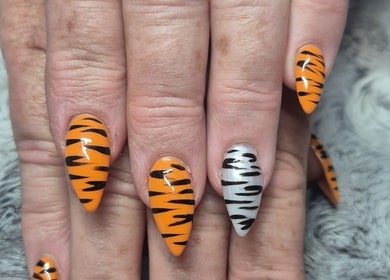 Vibrant tiger-striped nail design at Unique Nail Co, Kadina, South Australia, AU.