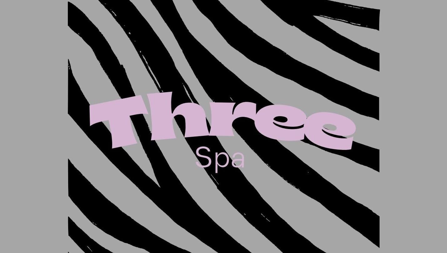 Stylish zebra pattern logo of Three Spa located in Doha, QA, symbolizing relaxation and luxury.