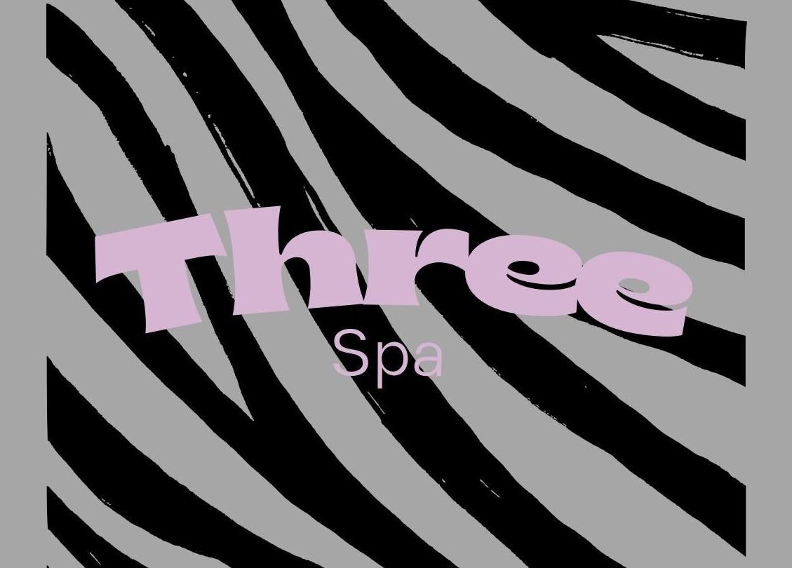 Stylish zebra pattern logo of Three Spa located in Doha, QA, symbolizing relaxation and luxury.