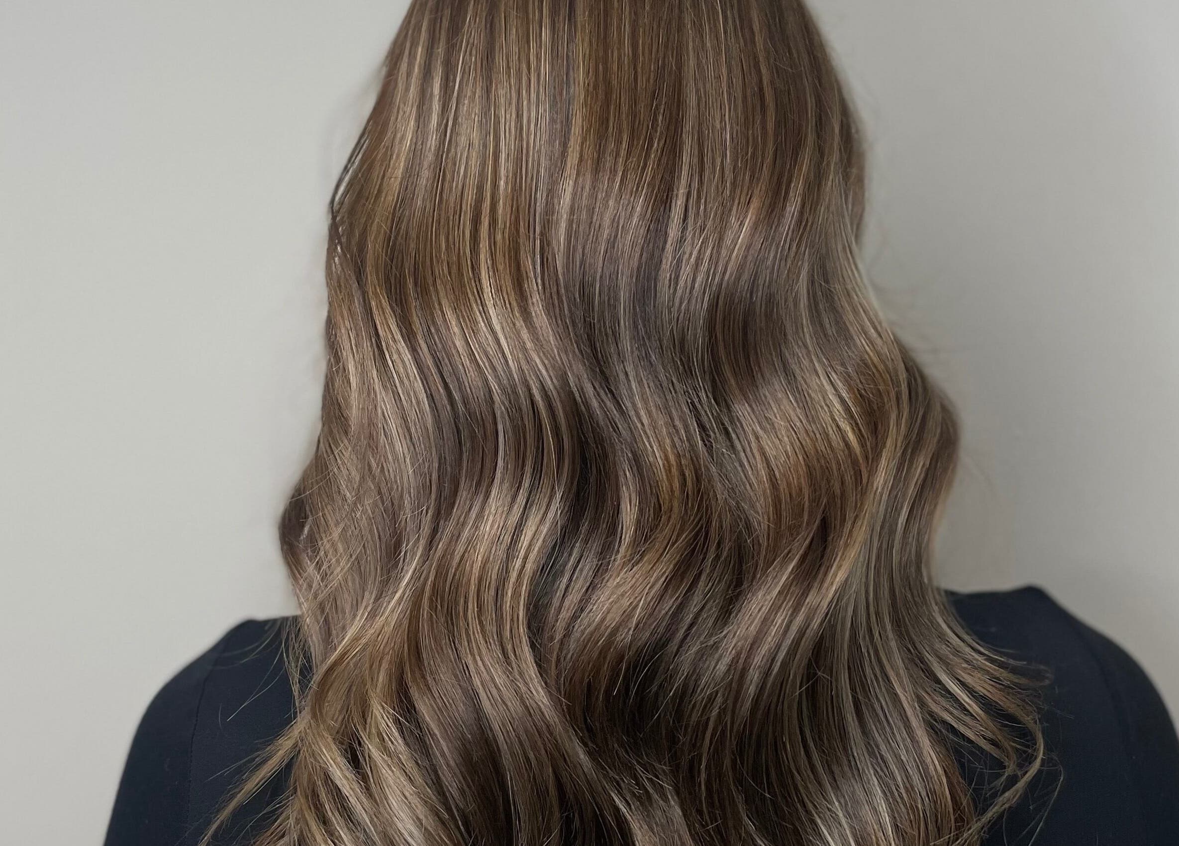 Long, silky waves styled at Hair by LW, Westhill, Scotland, GB. Highlighted for vibrant finish.