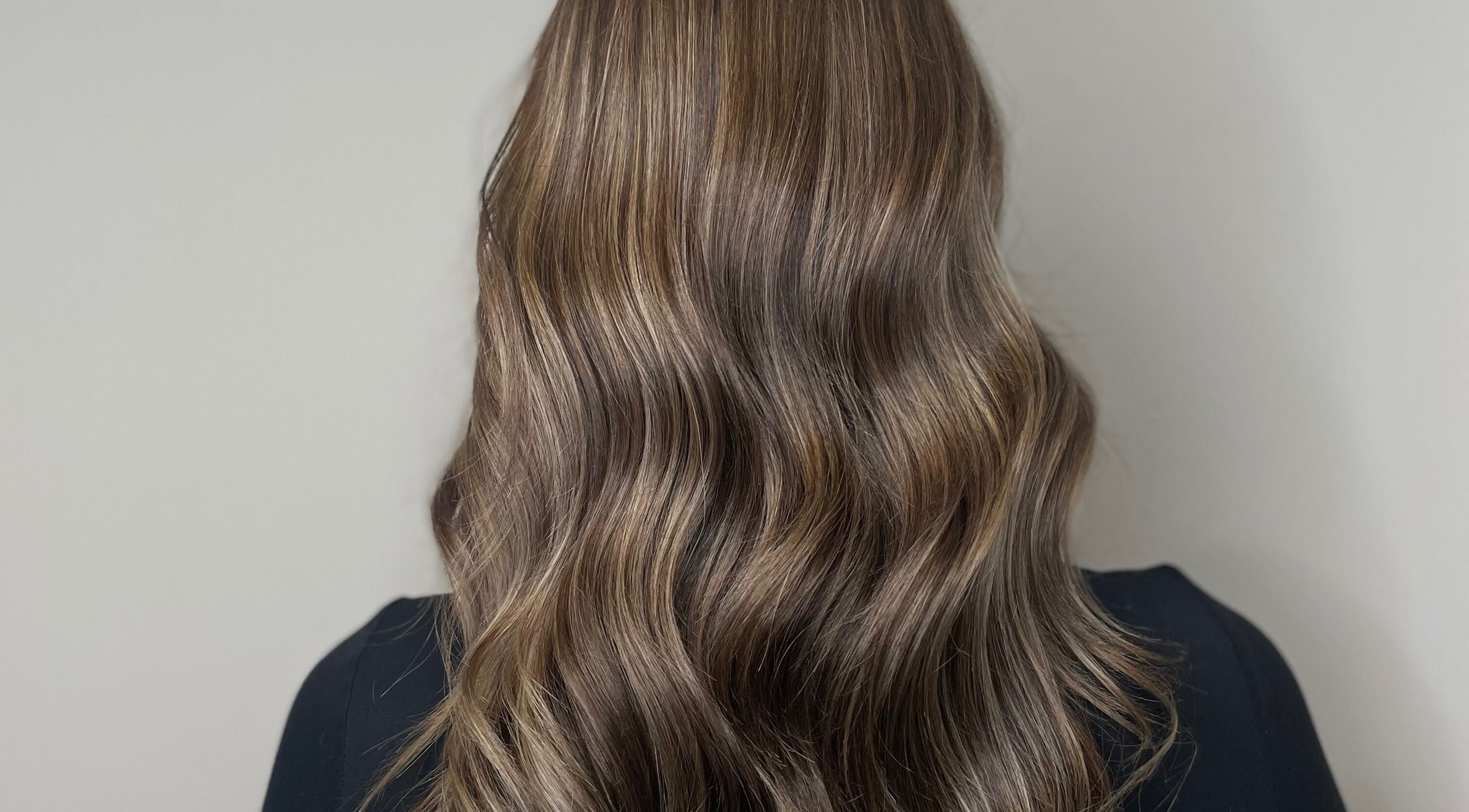 Long, silky waves styled at Hair by LW, Westhill, Scotland, GB. Highlighted for vibrant finish.