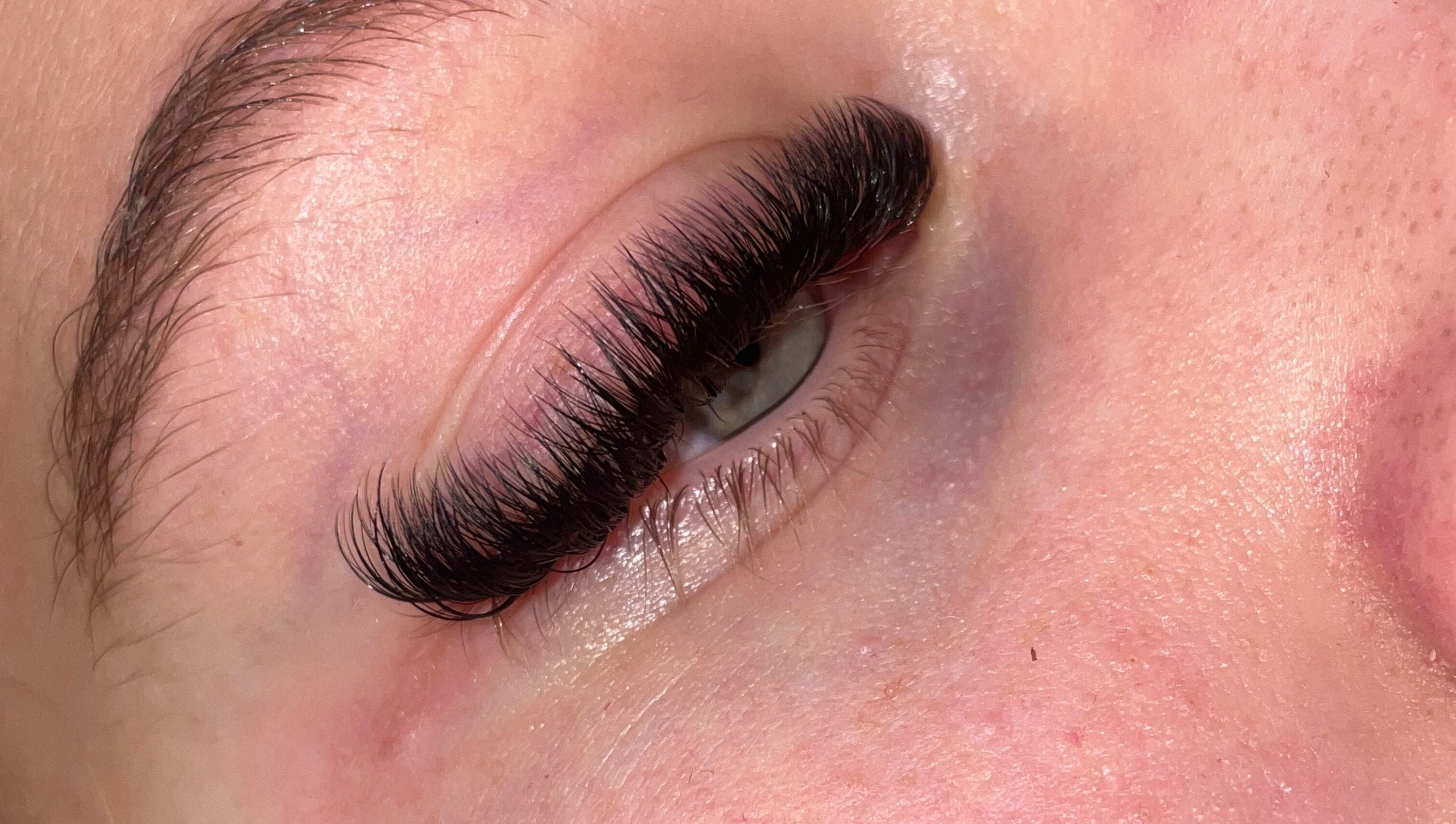 Close-up of expertly applied eyelash extensions at What the Fluff Lash Artistry, Chelmsford, England, GB.