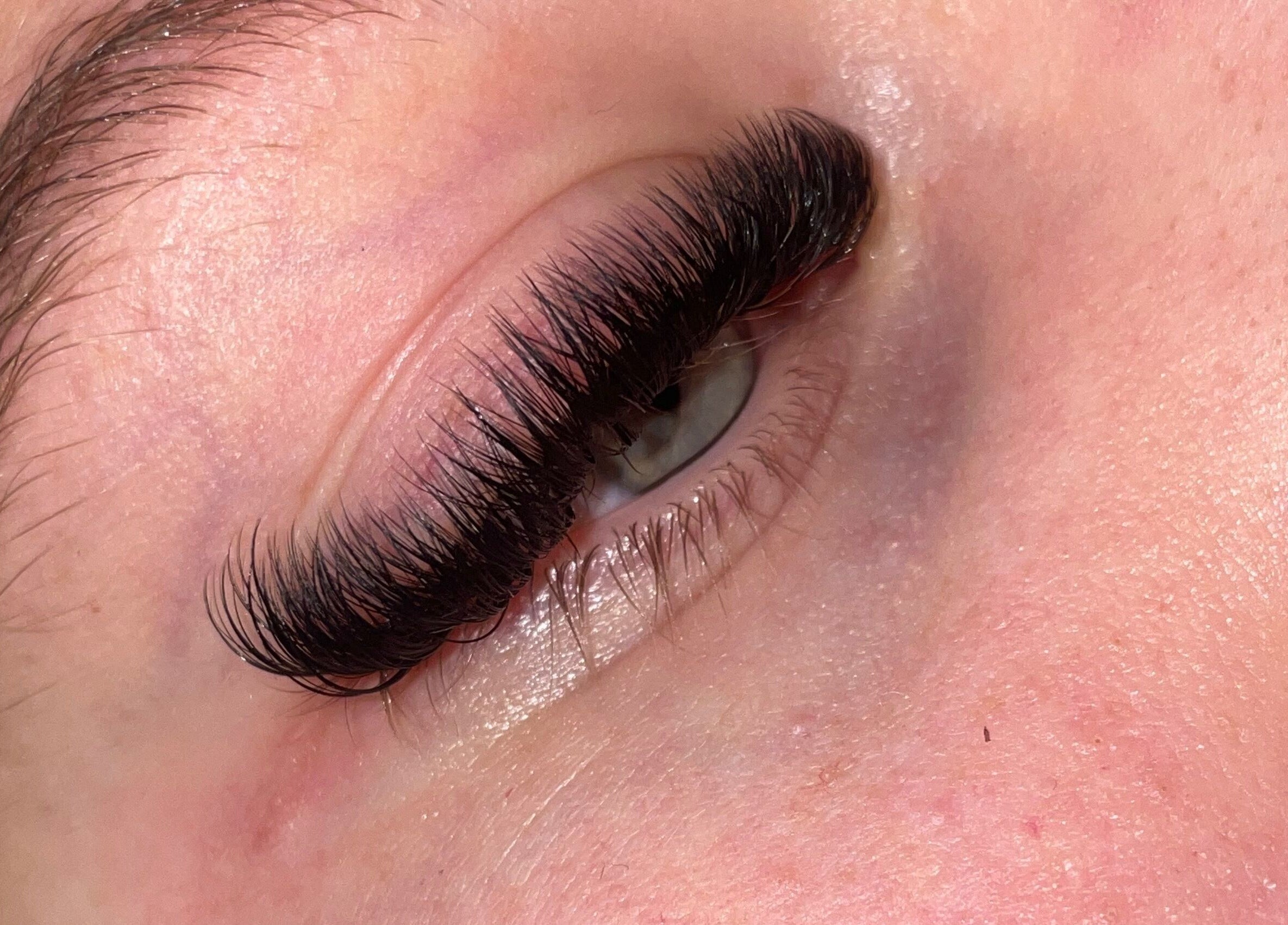 Close-up of expertly applied eyelash extensions at What the Fluff Lash Artistry, Chelmsford, England, GB.