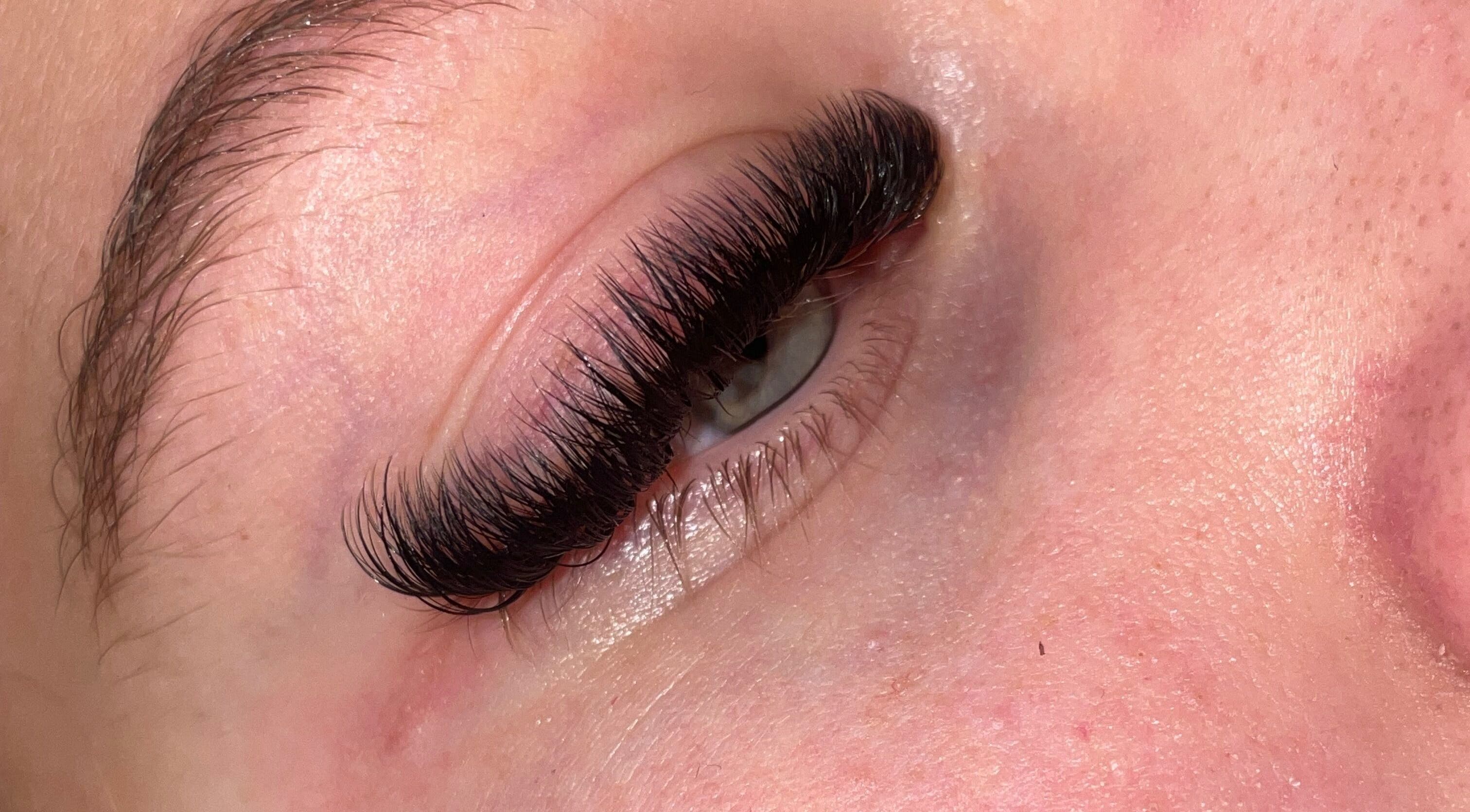Close-up of expertly applied eyelash extensions at What the Fluff Lash Artistry, Chelmsford, England, GB.